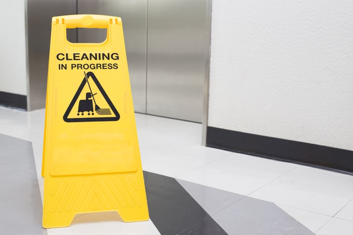 Cleaning in progress sign outside a lift